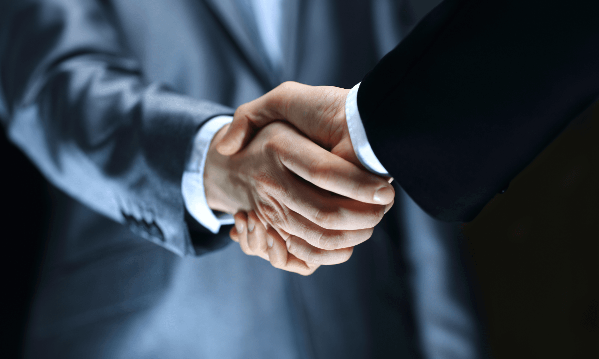 A stock photo of two people shaking hands