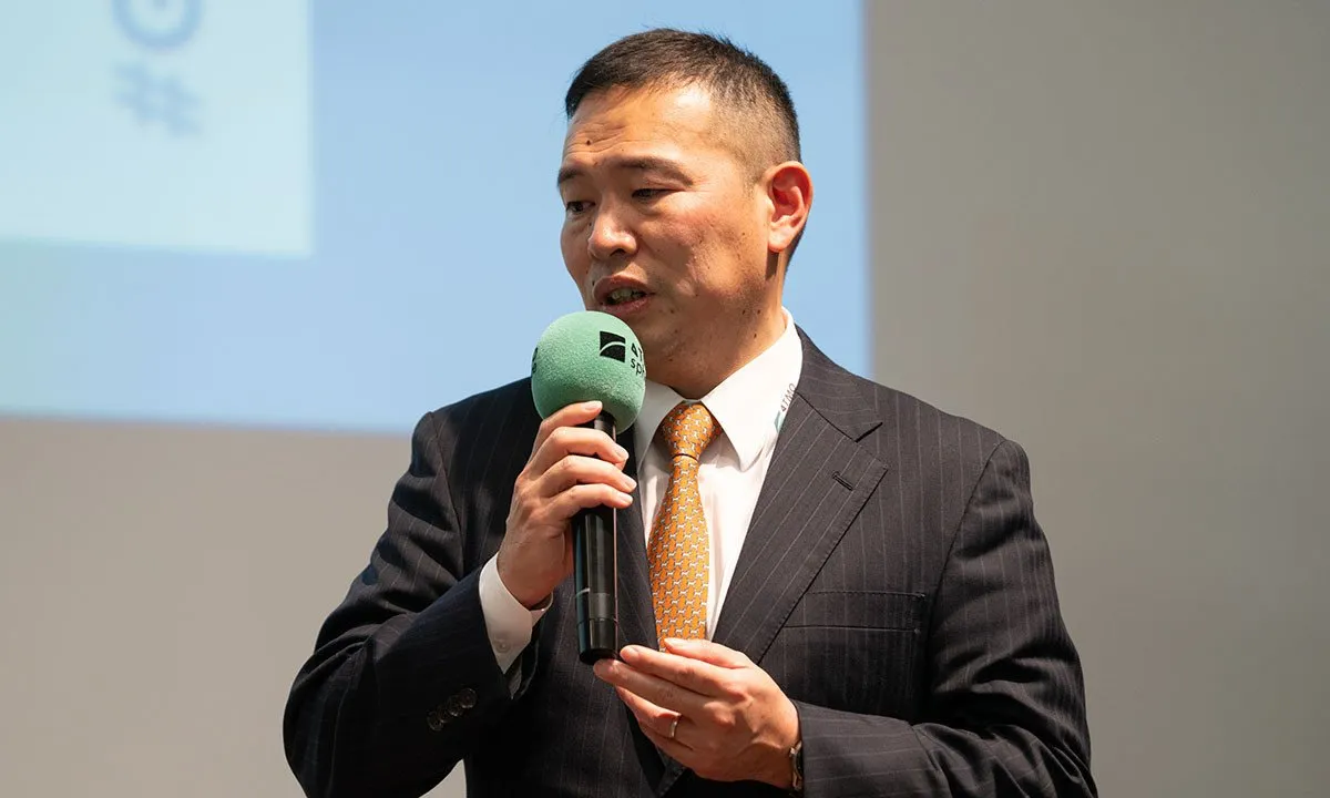 Saigan Atsushi presenting at ATMO 2024 APAC Summit about Distribution Center CO2