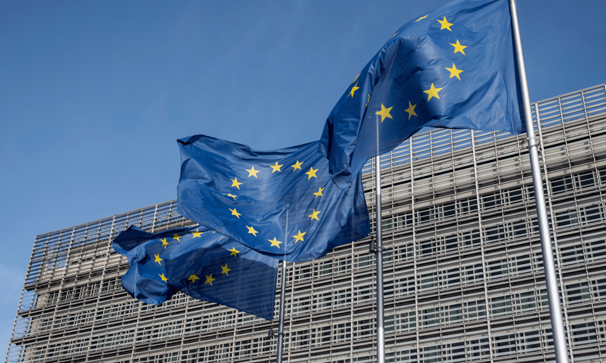 Flags flying in front of the European Commission building in Brussels.