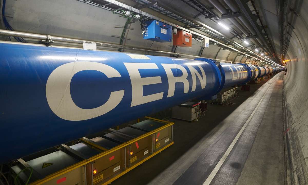 A chain of Large Hadron Collider dipole magnets inside the tunnel at the ATLAS site. Photo credit: Samuel Joseph Hertzog, CERN