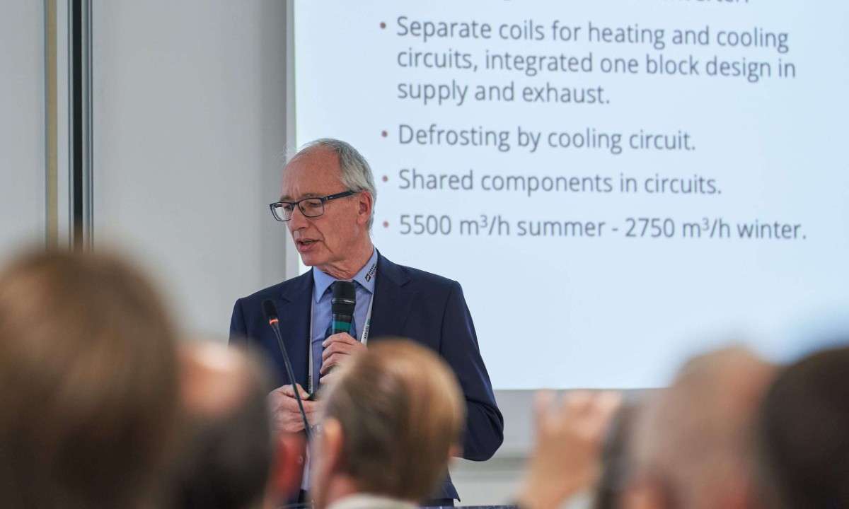 An image of Christian Heerup, Business Manager of Refrigeration at the Danish Technological Institute, presenting at ATMO Europe 2025. He discussed Unic Air's air handling unit with a CO2 heat pump.