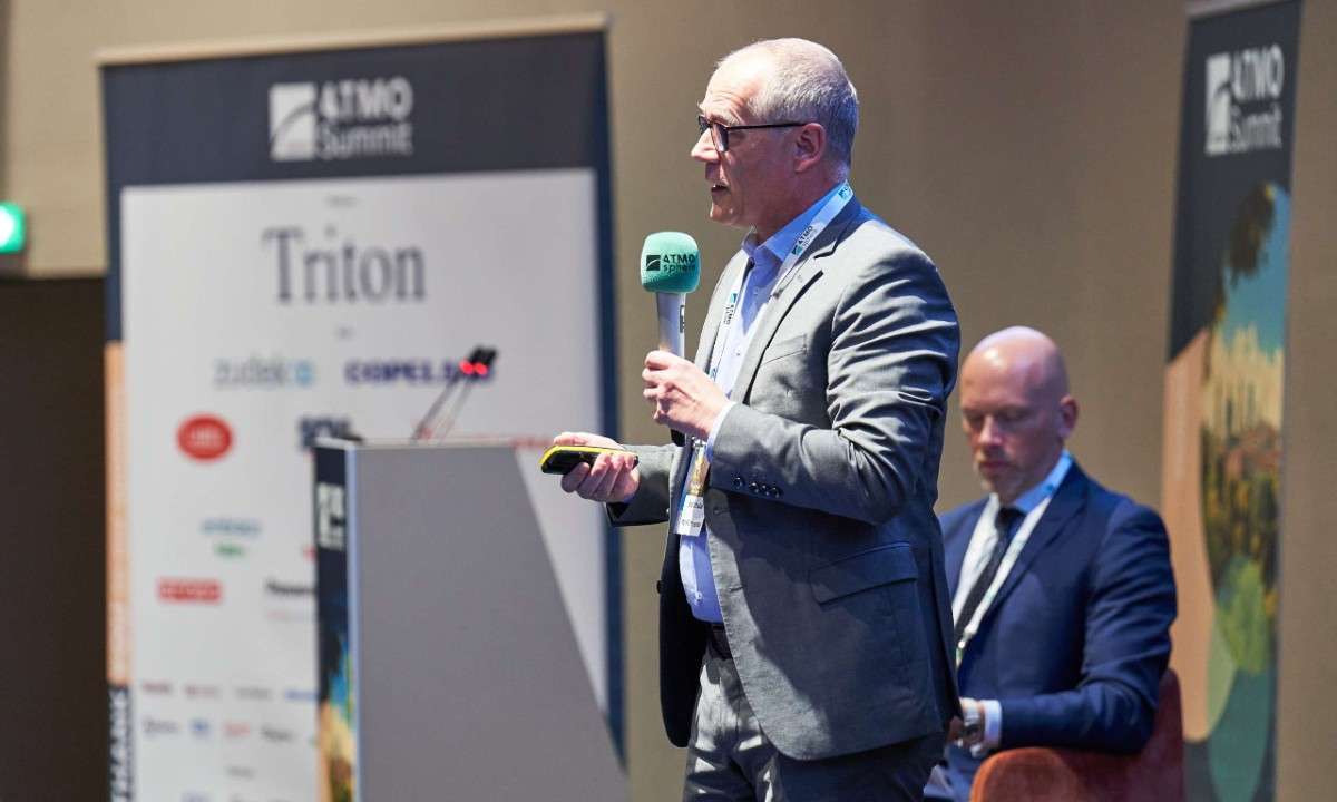 An image of Olaf Schulze, Director of Energy Management/Real Estate Sustainability at METRO Properties, presenting at ATMO Europe. He discussed decarbonization using CO2 refrigeration and propane cases.