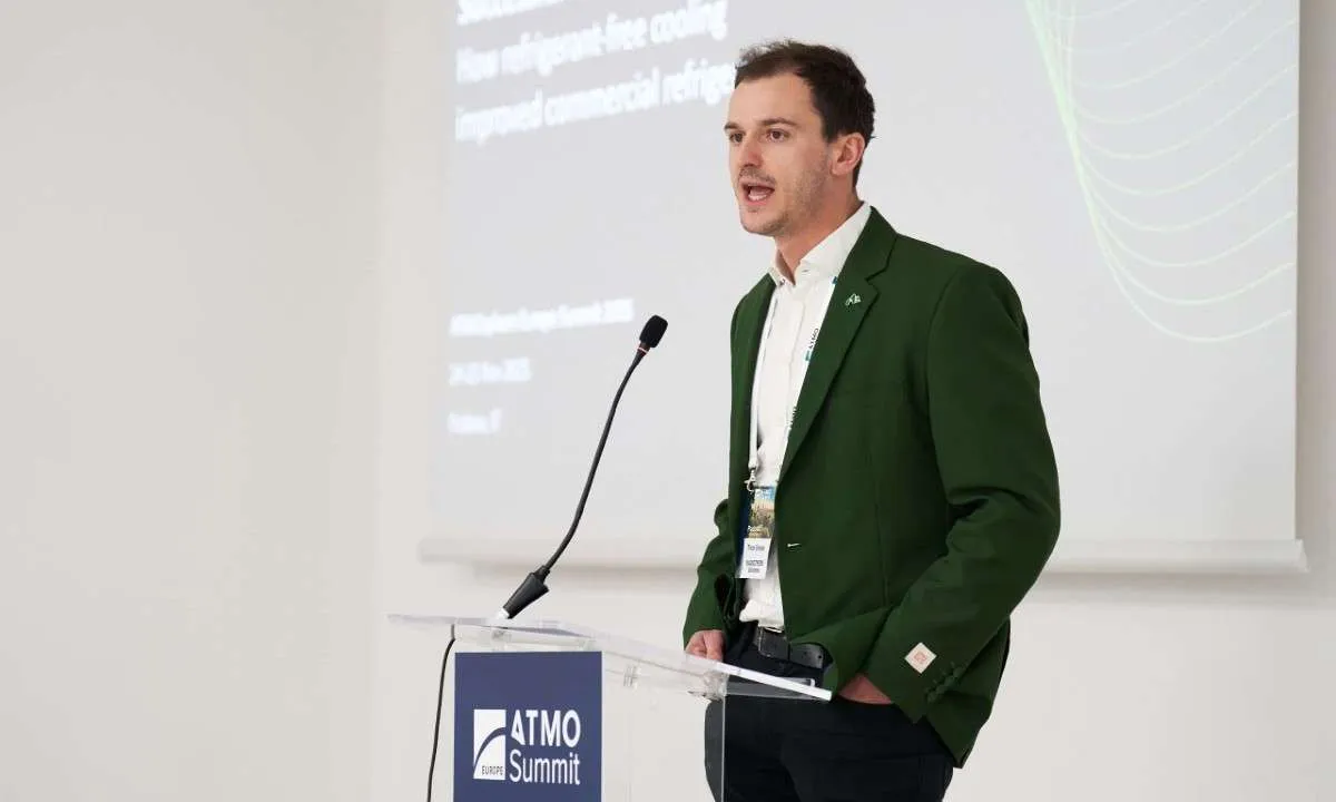 An image of Timur Sirman, CEO and Co-Founder of Magnotherm, presenting at ATMO Europe 2025. The company's refrigerant-free cooling system using magnetocaloric effect provides a sustainable option for refrigeration.