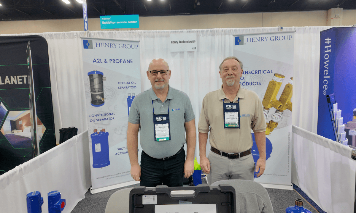 Aaron Arnold and Jesse Meredith at IIAR 2026 Expo showing Henry Group's CO2 components