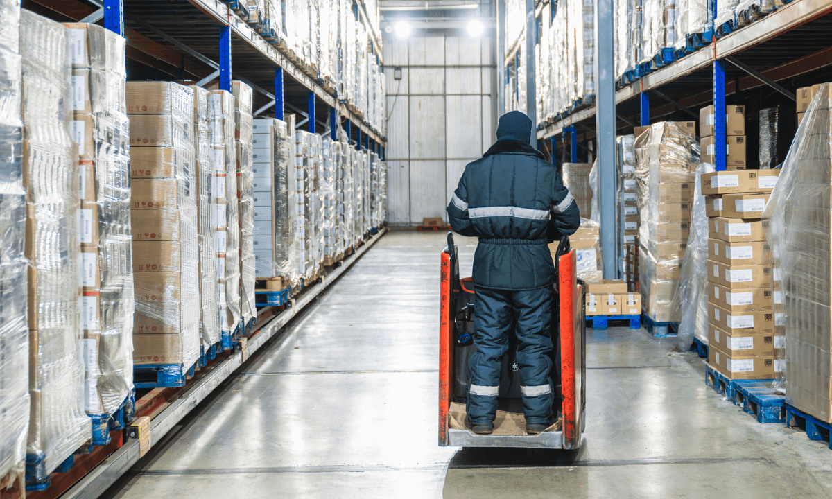 A worker in a cold storage warehouse. Cold storage warehouses need to recalibrate their temperature sensors after moving from HFCs to naturals.