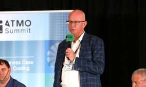 And image of Jay Smith, Vice President of Operations and Engineering at Evocative, presenting at ATMO America. He discussed CO2 chillers cooling 1.3MW data center heat load.