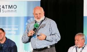 An image of Scott Ray, Director of Design, Construction and Procurement at Buc-ee's, presenting at ATMO America 2026. The company is moving to using CO2 refrigeration as a prototype for new builds.