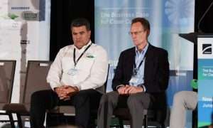 And image of Alessandro Silva, Senior Application Engineer at Bitzer, and John Collins, Director of Industrial Sales, participating at ATMO America 2026. The two highlighted a CO2 refrigeration system for a Nashville fulfillment center.
