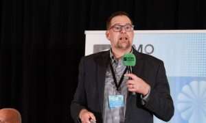 An image of Phillip Walker, General Manager at TechnoRef4, presenting at ATMO America 2026. He talked aobut an Americold Canadian facility using single-stage transcritical CO2 refrigeration.
