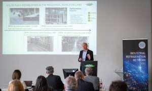 An image of Manuel Reichle, Product Manager of Reciprocating Compressors at Bitzer, presenting at INR 2026. CO2 refrigeration fit for cruise industry.